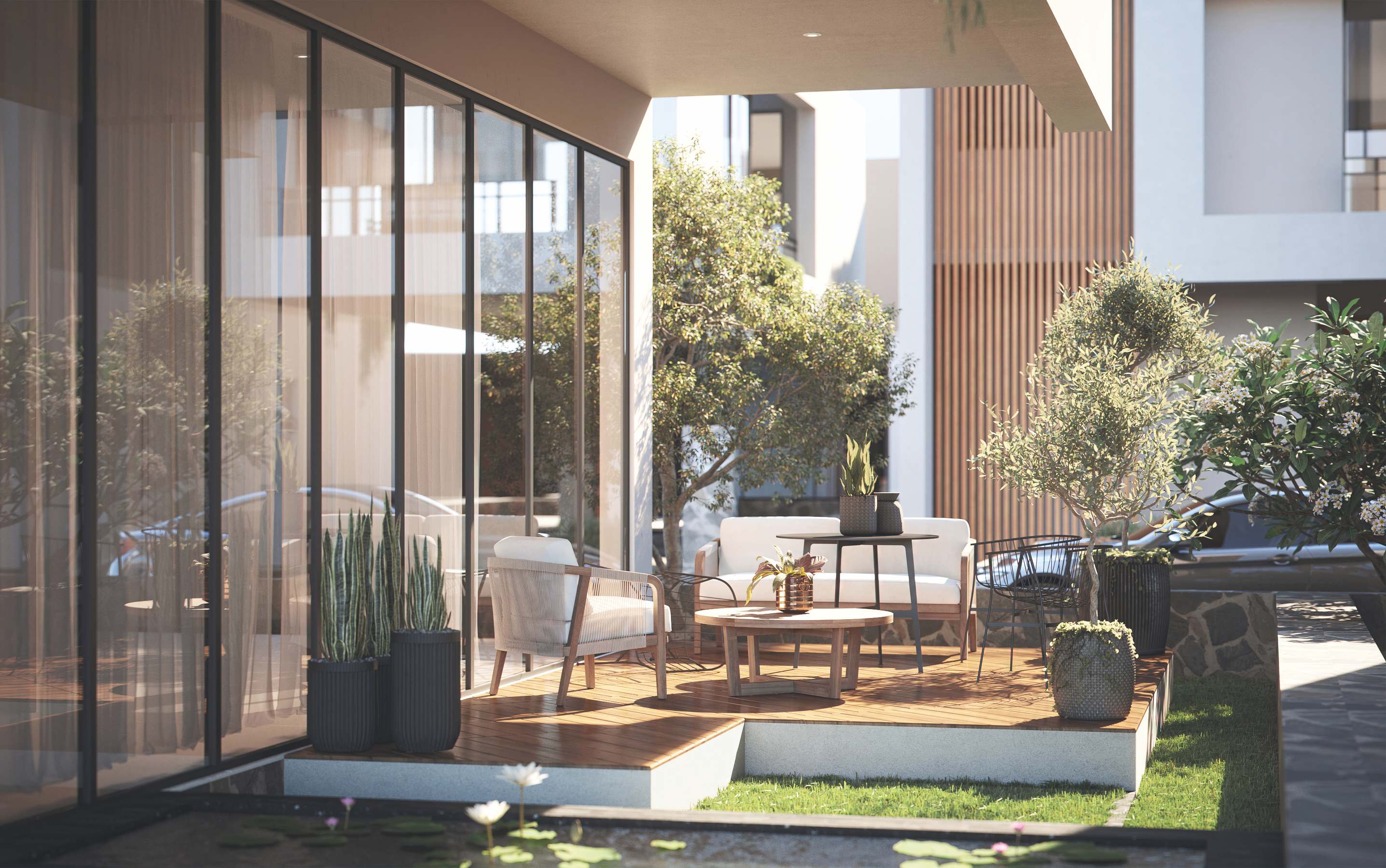 The deck, laid out with seating beside the lawn.