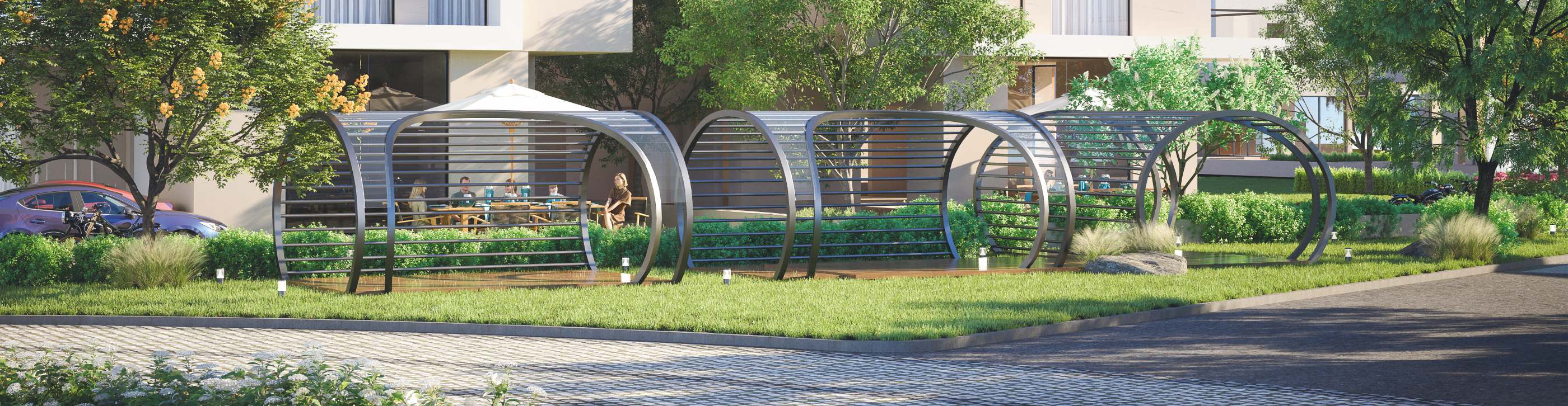 Arched pergolas over seating on the lawn